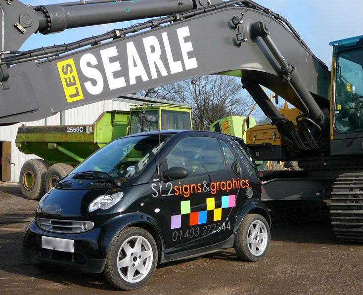 Black SL2 car with Searle consruction vehicle