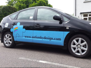 Autism by design vehicle graphic